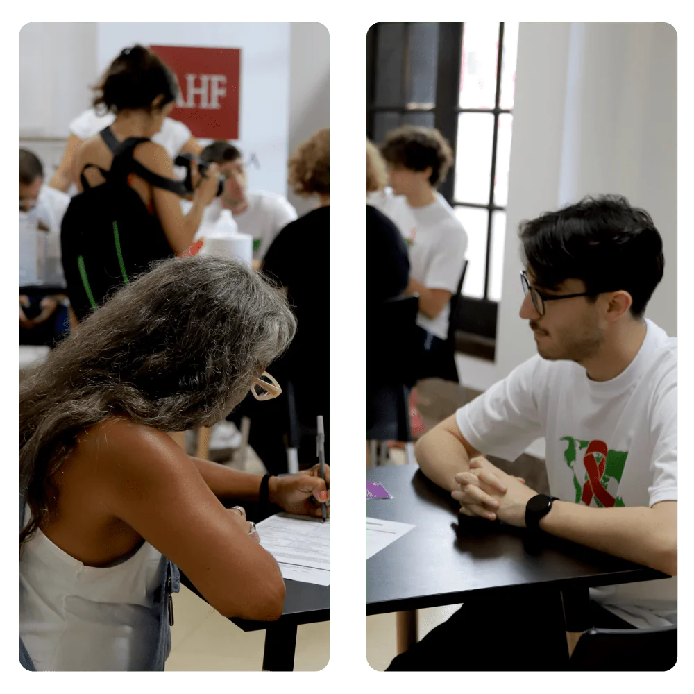 Persona completa un formulario mientras voluntario de AHF Argentina brinda orientación durante una jornada de testeo.